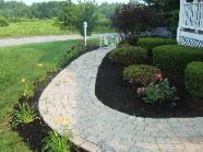 walk way installation day lillies roses mulch
